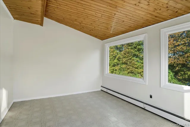 wooden floor with a view of a living room