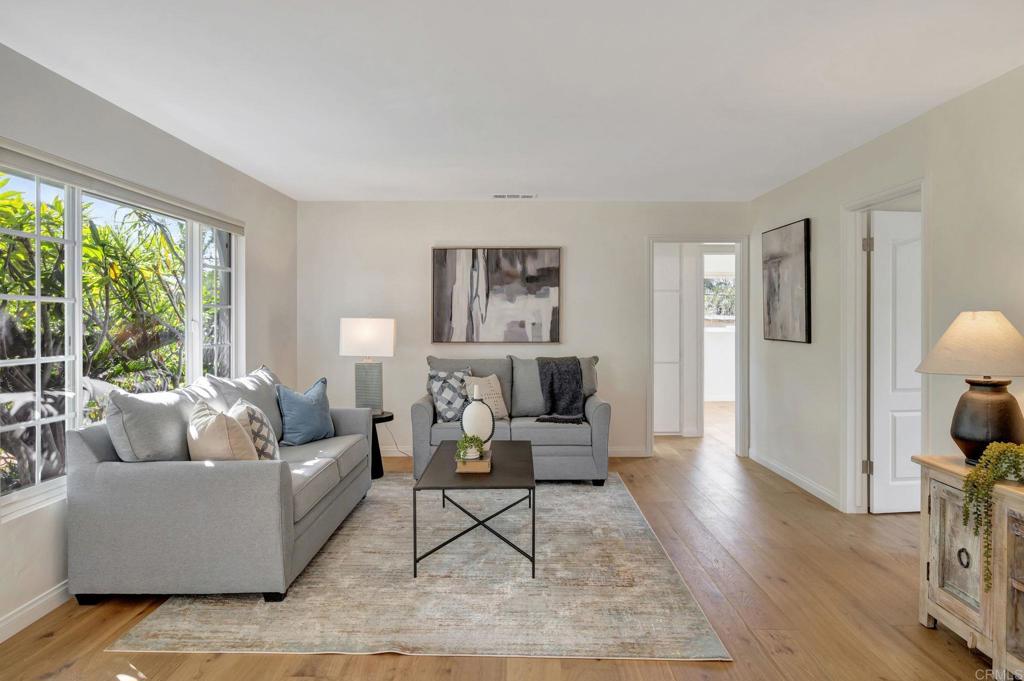 732 Osborne Street Vista, CA 92084 - Photo 7 of 44 a living room with furniture and a wooden floor