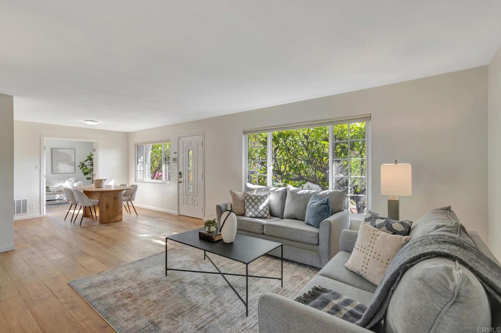 732 Osborne Street Vista, CA 92084 - Photo 8 of 44 a living room with furniture and a large window