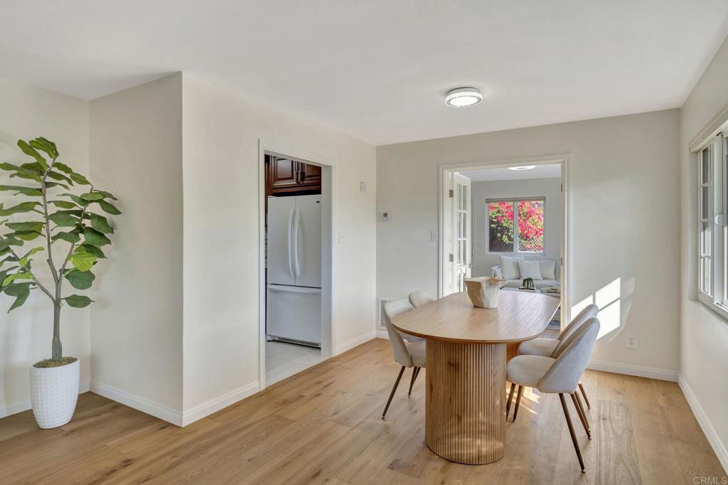 732 Osborne Street Vista, CA 92084 - Photo 10 of 44 a view of a dining room with furniture and wooden floor