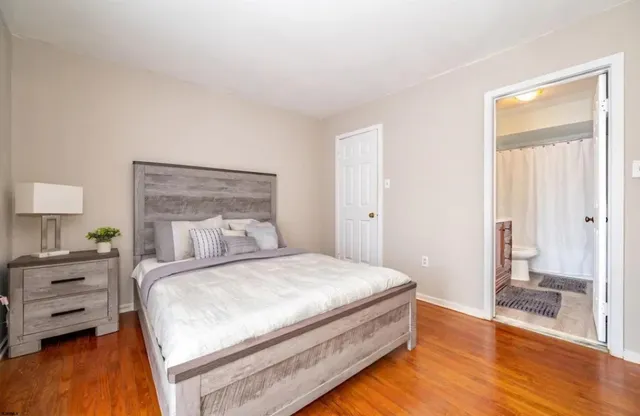 a bedroom with a bed and a view of bedroom