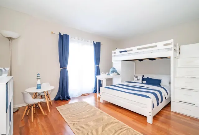 a bedroom with a bed and a table in it