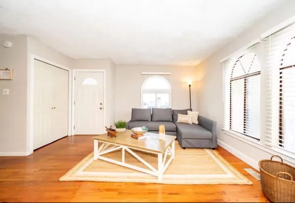 a living room with furniture and a table