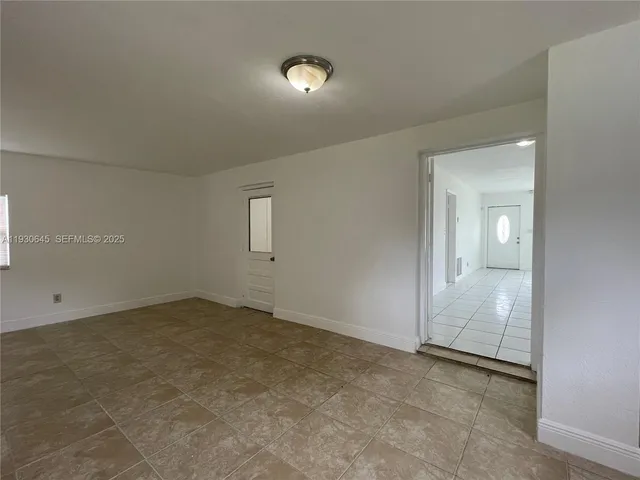 an empty room with a bathroom