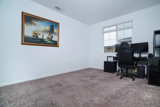 a workspace with furniture and window