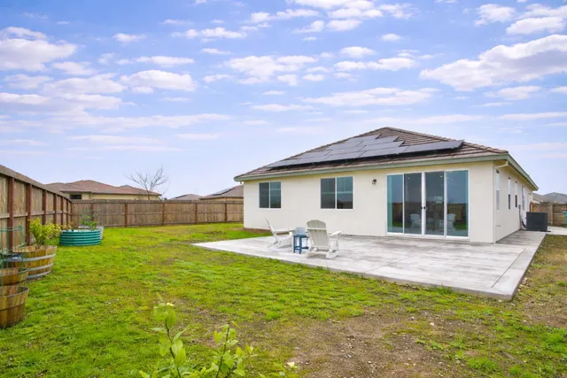 a front view of house with yard and seating space