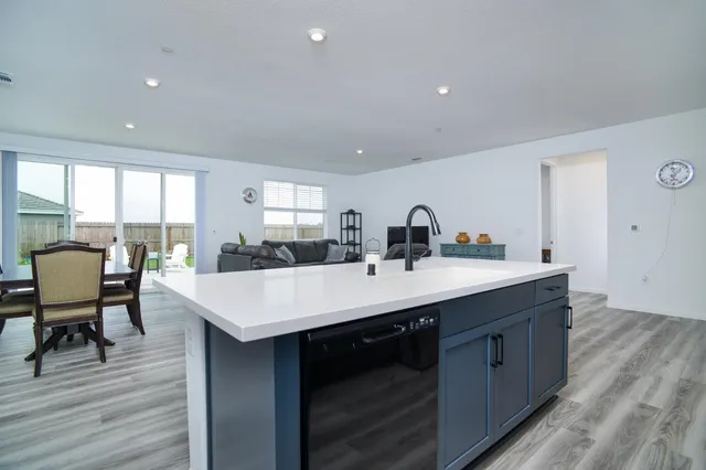 a room with two chairs a table and chairs in it