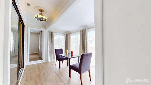 a view of a livingroom with furniture and a window