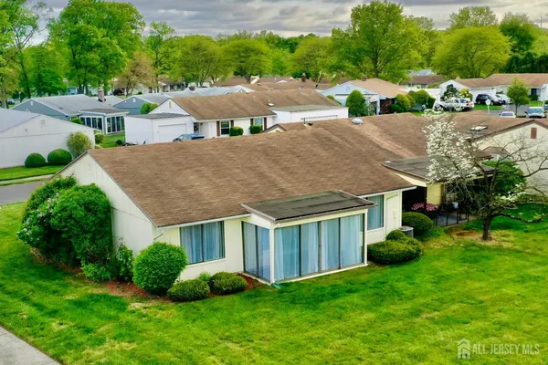 an aerial view of a house with a garden