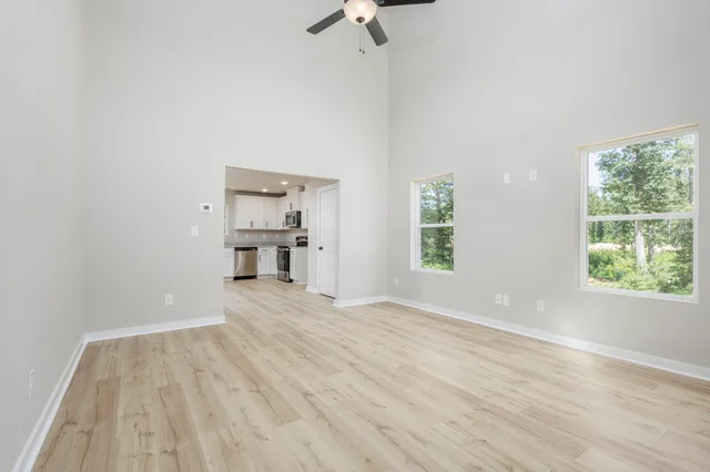 wooden floor in an empty room with a window