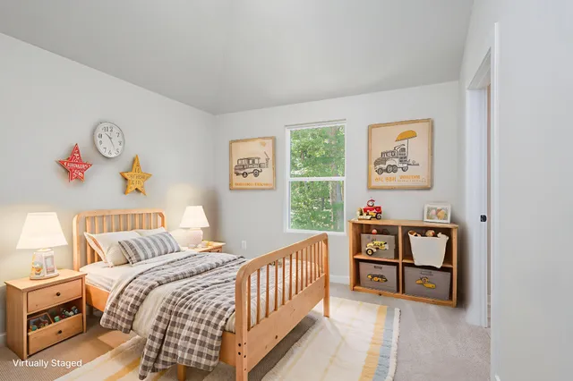 a bedroom with furniture and a window