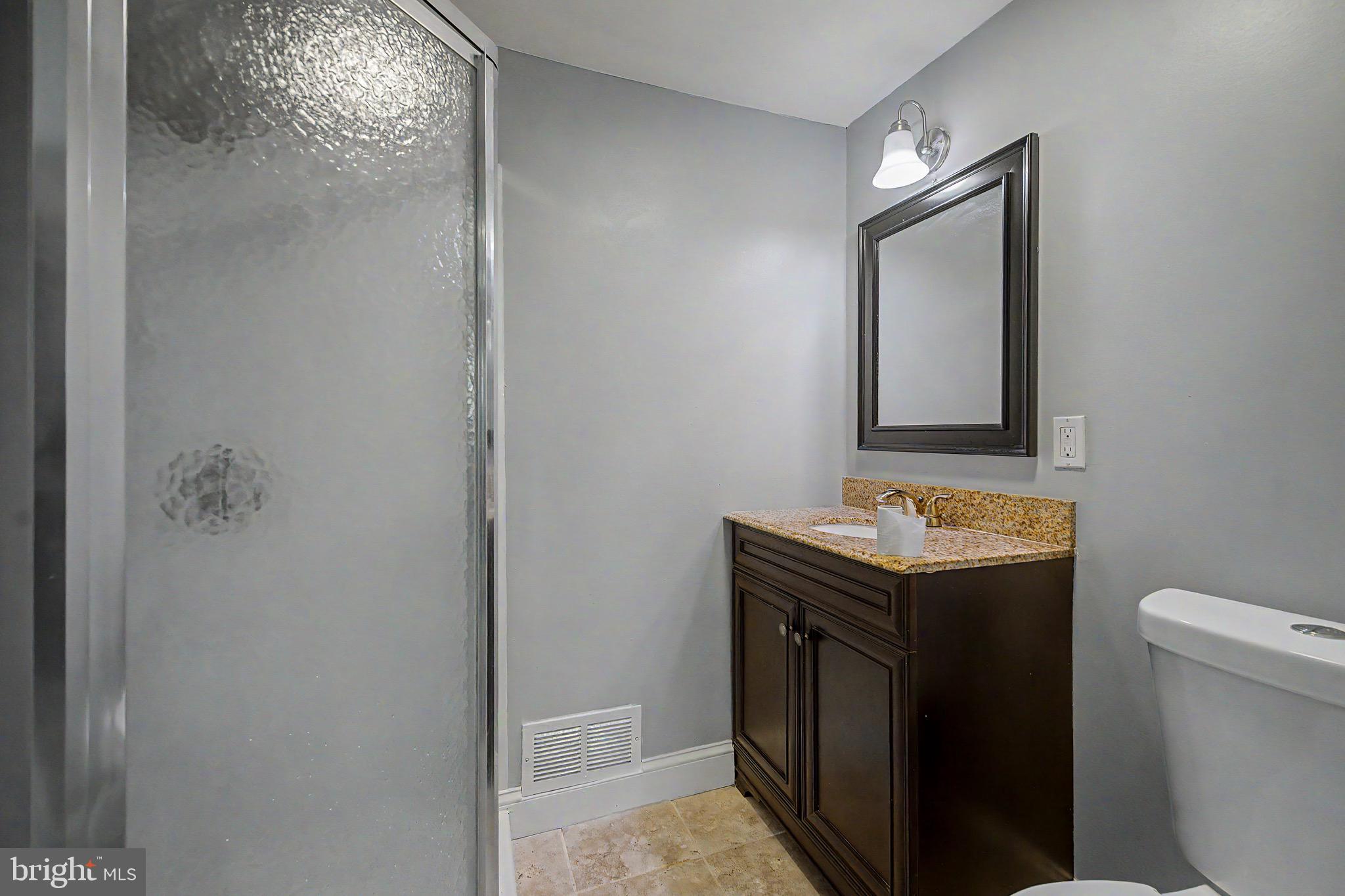 16 Malvern Road Newark, DE 19713 - Photo 27 of 35 a bathroom with a toilet sink and mirror