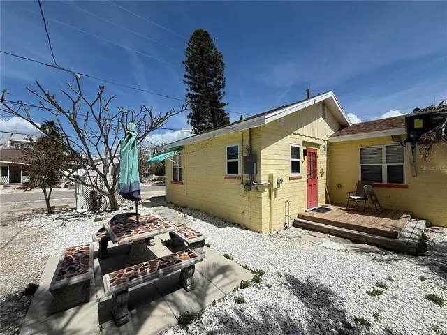a view of a house with a snow in the yard