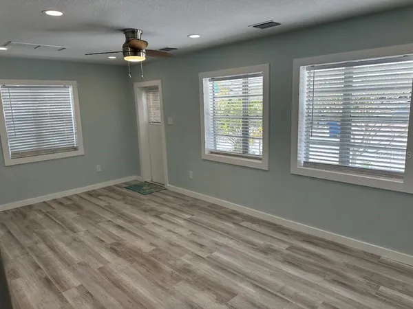 a view of an empty room with a window