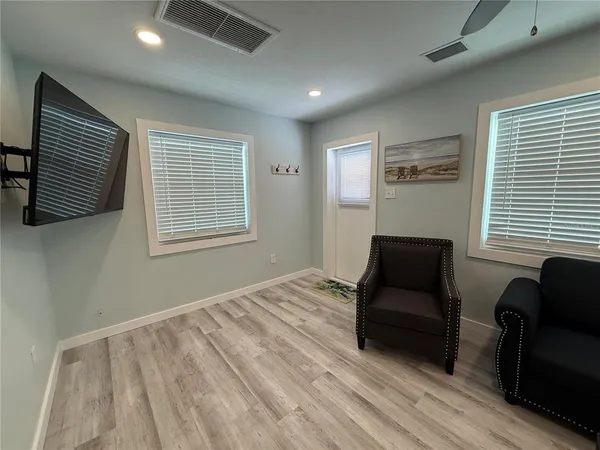 a bedroom with furniture and a window