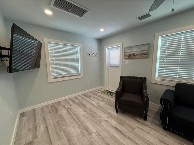 a bedroom with furniture and a window