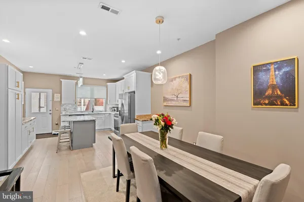a view of a dining room with furniture and a livingroom