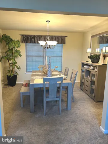 a spacious bedroom with a bed and a large window