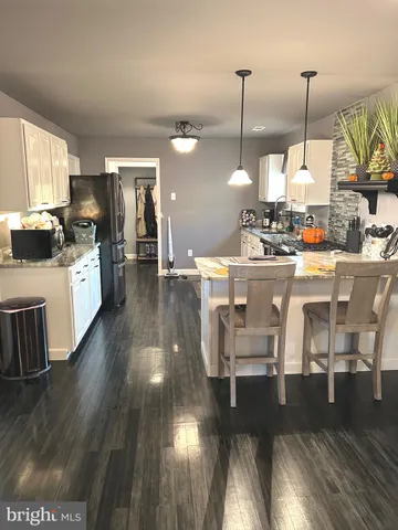 a bathroom with a bathtub sink and window
