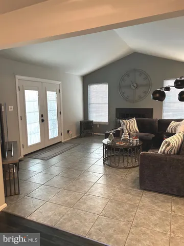 a view of a bathroom with a sink and a mirror