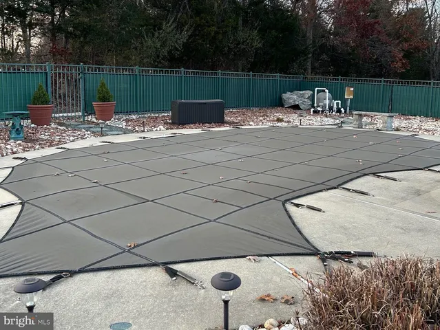 a living room with furniture and a lamp