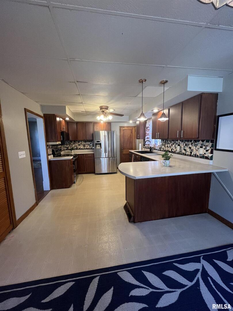 328 East Prospect Street Kewanee, IL 61443 - Photo 11 of 41 a large kitchen with stainless steel appliances a large counter top
