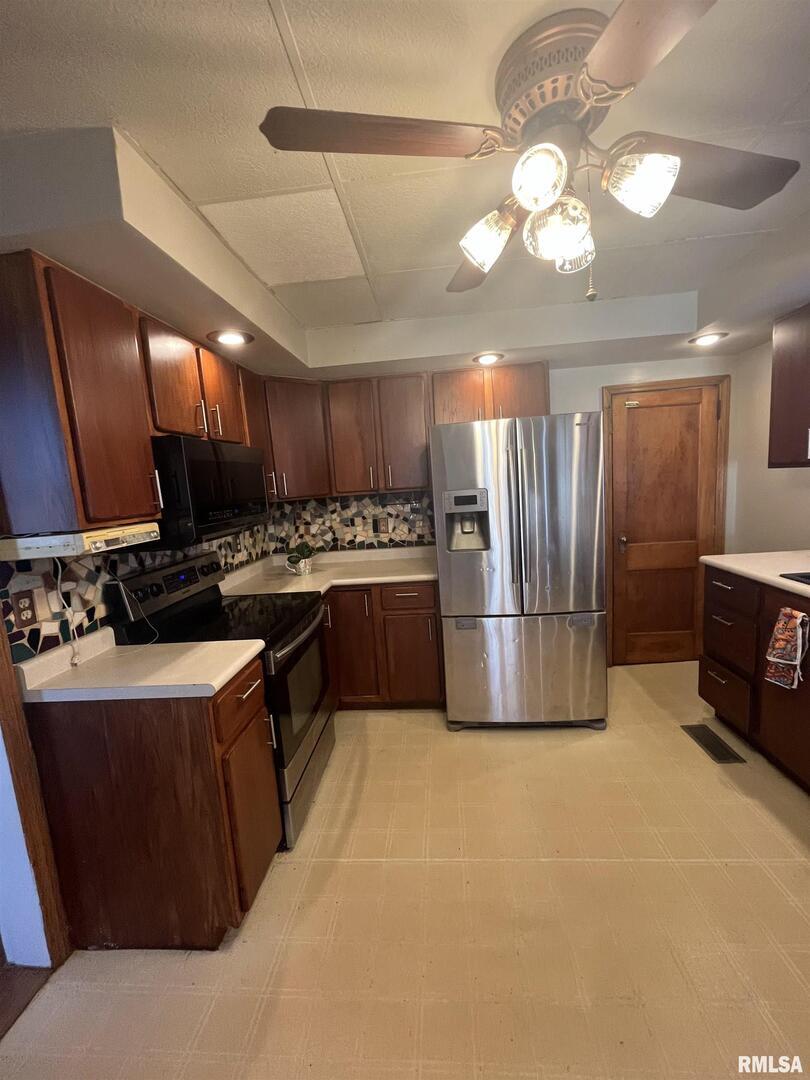 328 East Prospect Street Kewanee, IL 61443 - Photo 12 of 41 a kitchen with stainless steel appliances granite countertop a sink a stove and a refrigerator