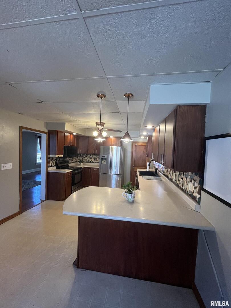 328 East Prospect Street Kewanee, IL 61443 - Photo 16 of 41 a large kitchen with stainless steel appliances a large counter top
