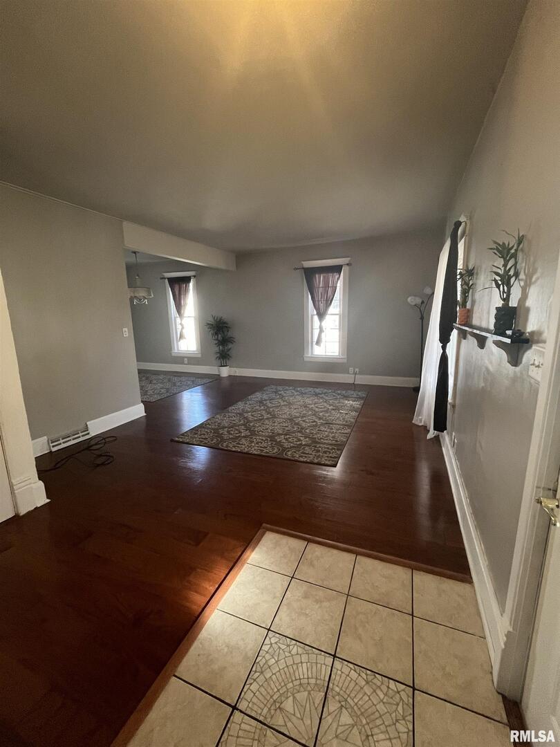 328 East Prospect Street Kewanee, IL 61443 - Photo 6 of 41 a view of a refrigerator in kitchen and an empty room
