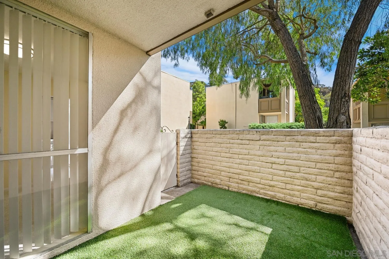 4881 Collwood Boulevard, Unit A San Diego, CA 92115 - Photo 17 of 25 a view of a backyard with pathway