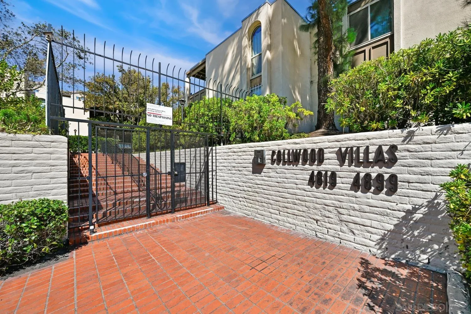 4881 Collwood Boulevard, Unit A San Diego, CA 92115 - Photo 22 of 25 a view of a deck with a wooden fence with a bench