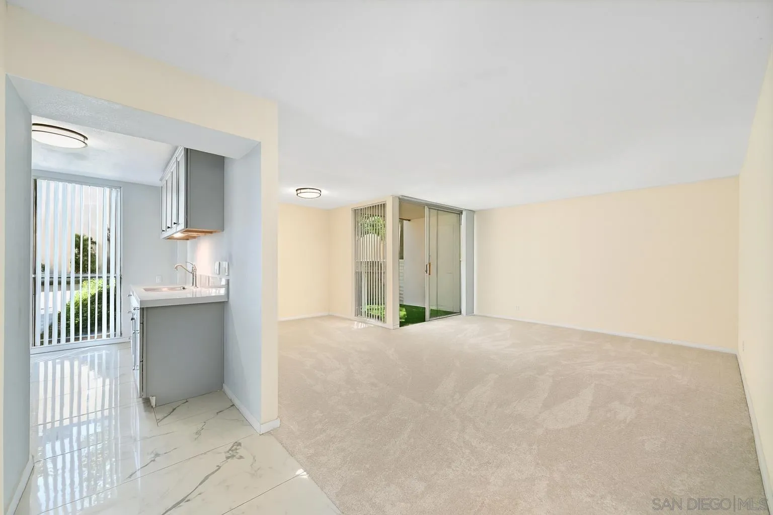 4881 Collwood Boulevard, Unit A San Diego, CA 92115 - Photo 6 of 25 a view of an empty room with a window