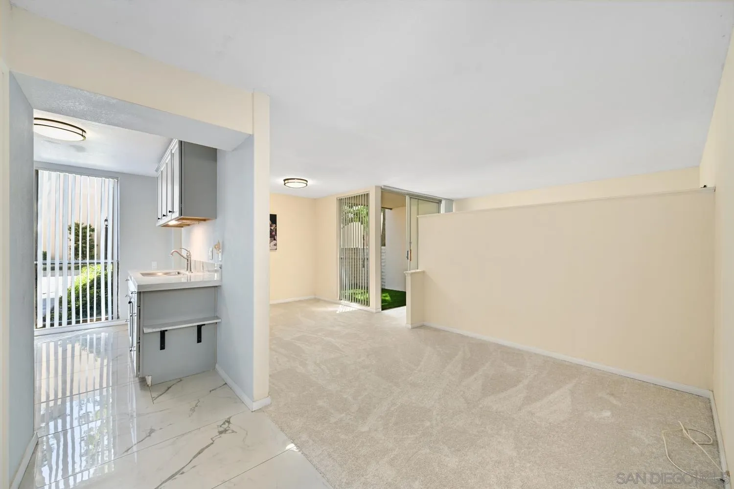 4881 Collwood Boulevard, Unit A San Diego, CA 92115 - Photo 7 of 25 en empty room with a kitchen and a sink