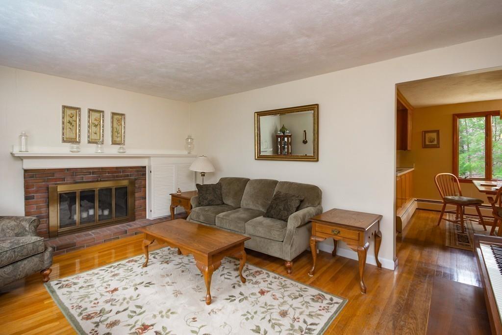 10 Kelch Road Reading, MA 01867 - Photo 11 of 16 a living room with furniture and a fireplace