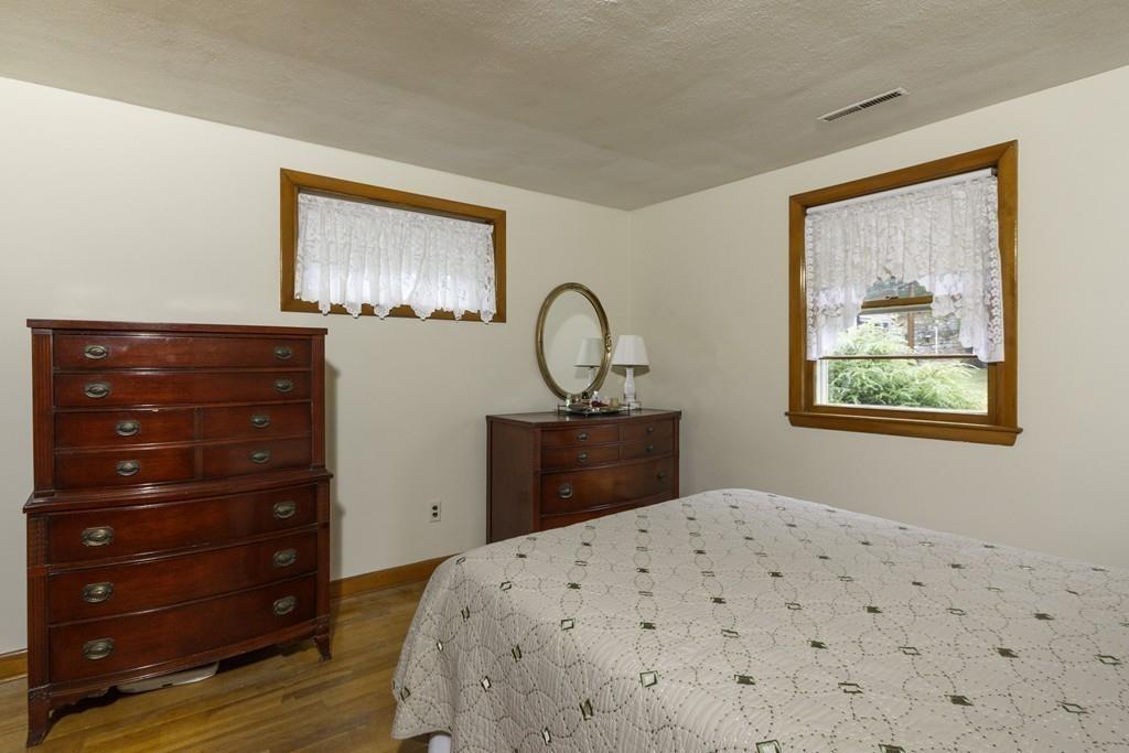 10 Kelch Road Reading, MA 01867 - Photo 13 of 16 a bedroom with a bed and a dresser