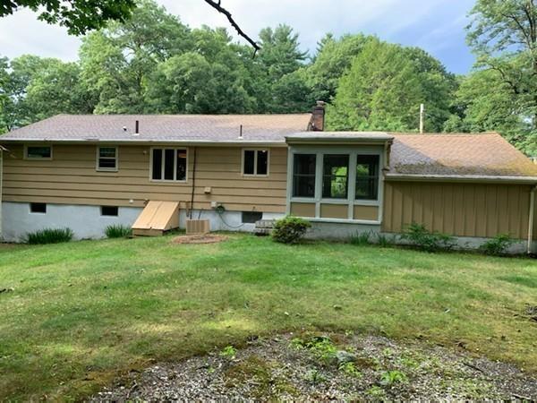10 Kelch Road Reading, MA 01867 - Photo 3 of 16 a front view of a house with garden