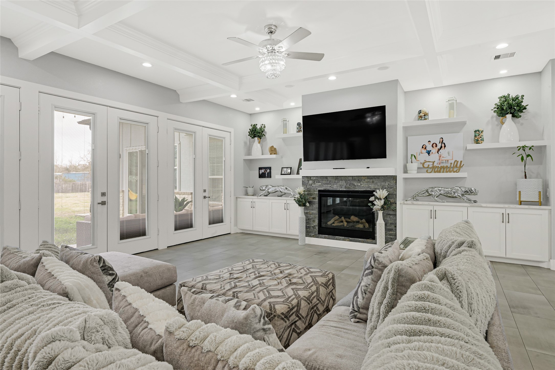 4821 1st Street Houston, TX 77504 - Photo 5 of 48 a living room with furniture a flat screen tv and a fireplace