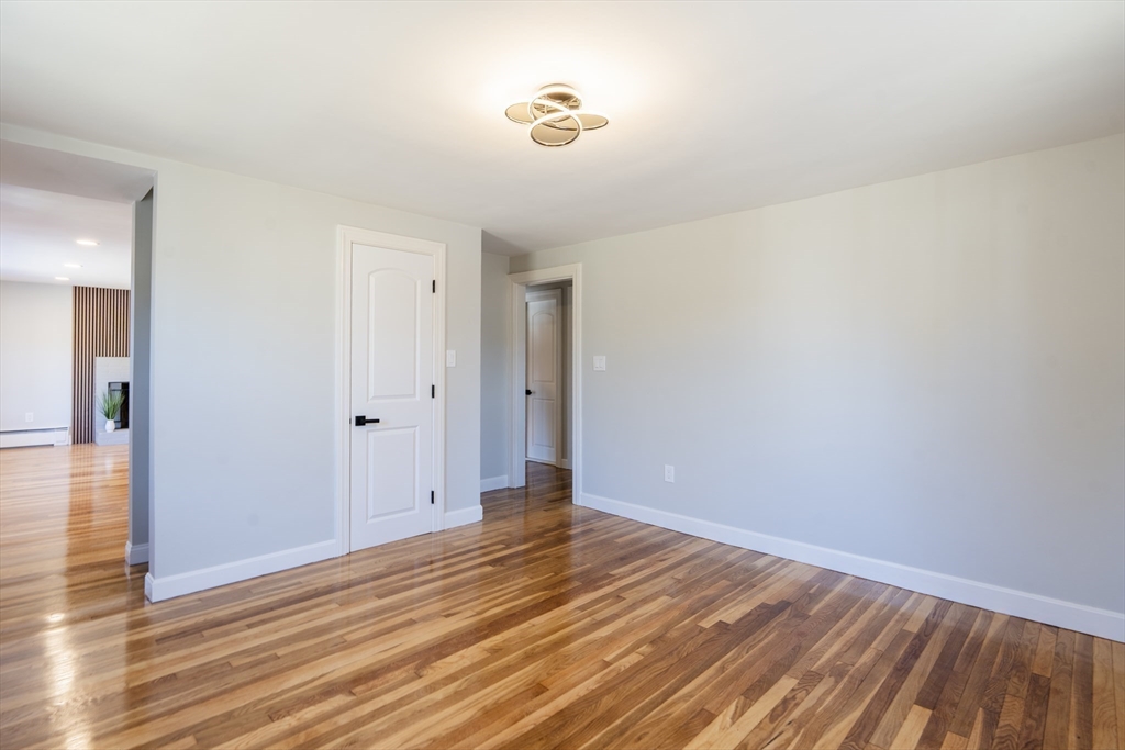 1049 Pleasant Street Canton, MA 02021 - Photo 12 of 34 a view of an empty room with wooden floor