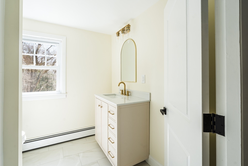1049 Pleasant Street Canton, MA 02021 - Photo 18 of 34 a view of bathroom with dual sinks