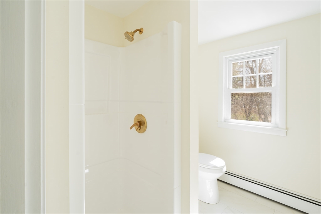 1049 Pleasant Street Canton, MA 02021 - Photo 20 of 34 a bathroom with a sink and a toilet
