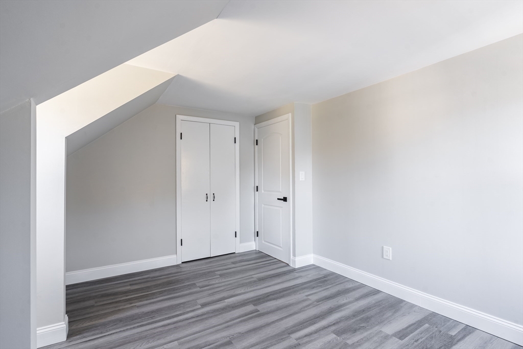 1049 Pleasant Street Canton, MA 02021 - Photo 23 of 34 a view of an empty room with wooden floor