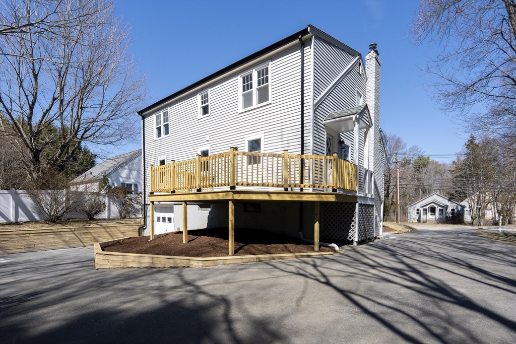 1049 Pleasant Street Canton, MA 02021 - Photo 3 of 34 a front view of a house with a yard