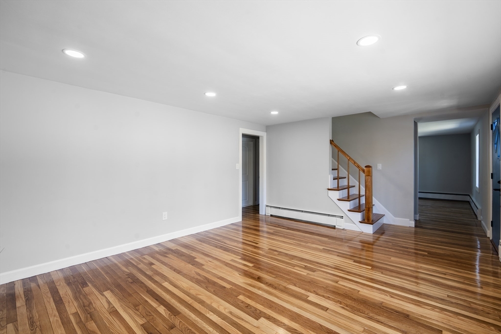1049 Pleasant Street Canton, MA 02021 - Photo 9 of 34 a view of an empty room with wooden floor