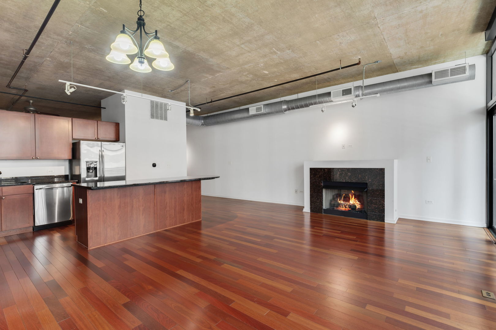 520 South State Street, Unit 705 Chicago, IL 60605 - Photo 13 of 33 a view of a room with wooden floor and a kitchen