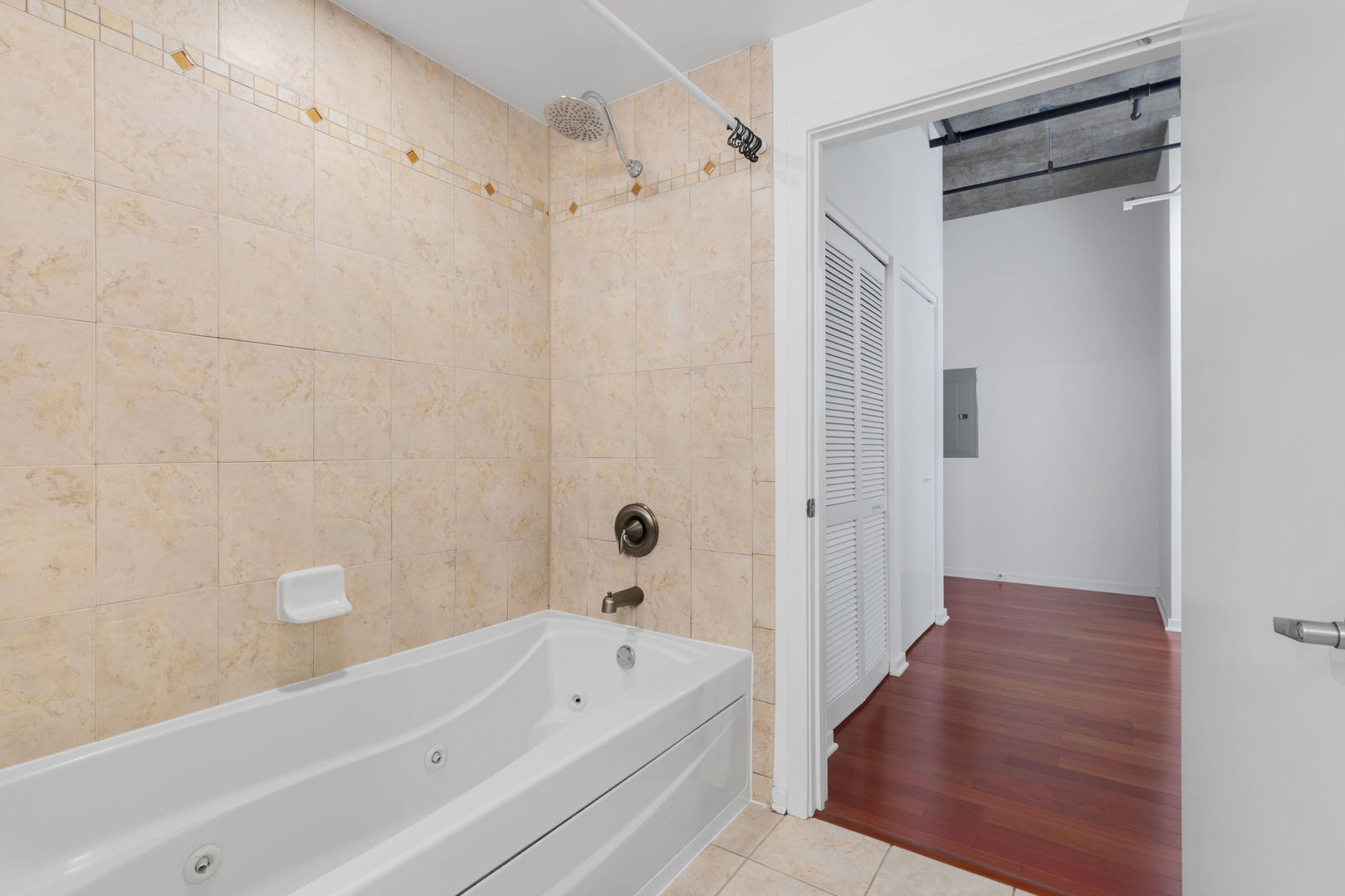 520 South State Street, Unit 705 Chicago, IL 60605 - Photo 25 of 33 a bathroom with a tub shower vanity and a sink