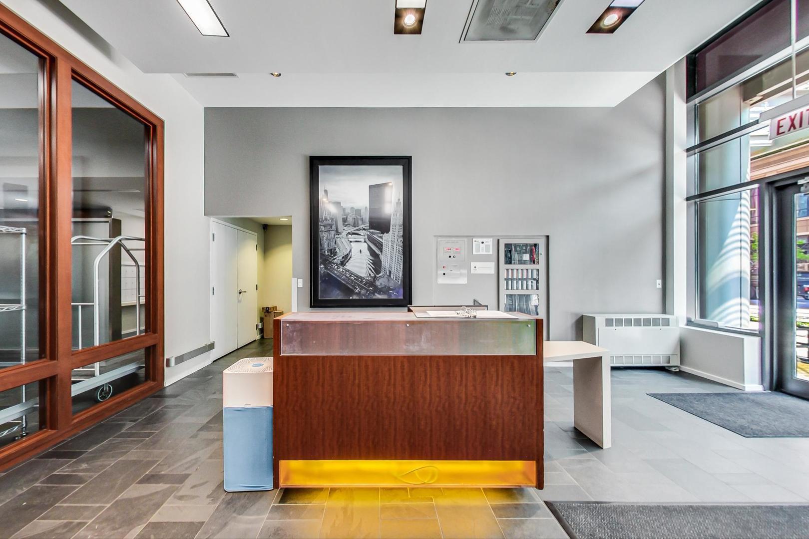 520 South State Street, Unit 705 Chicago, IL 60605 - Photo 5 of 33 a living room with furniture and a flat screen tv