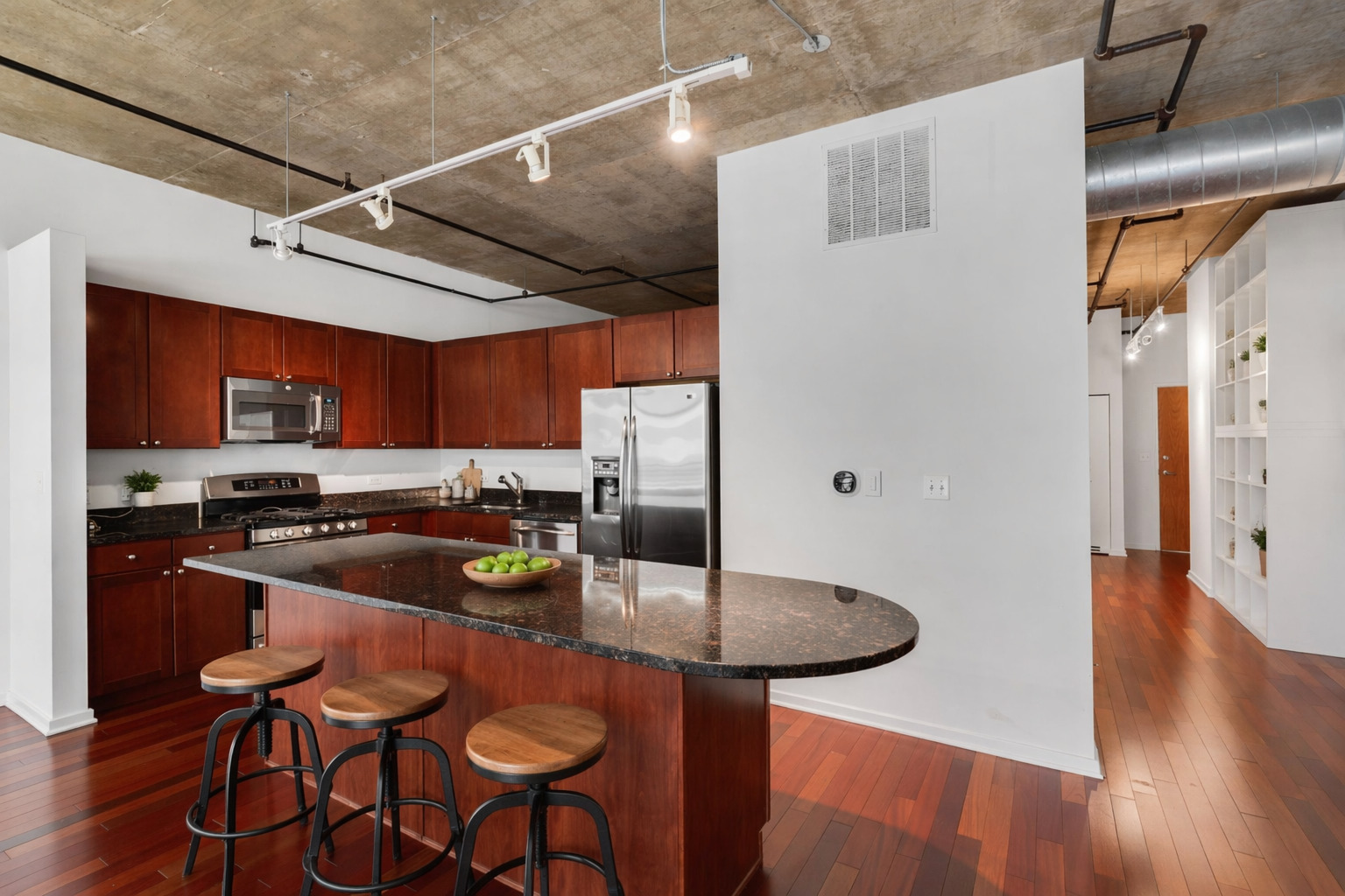 520 South State Street, Unit 705 Chicago, IL 60605 - Photo 8 of 33 a kitchen with stainless steel appliances granite countertop a sink and a refrigerator