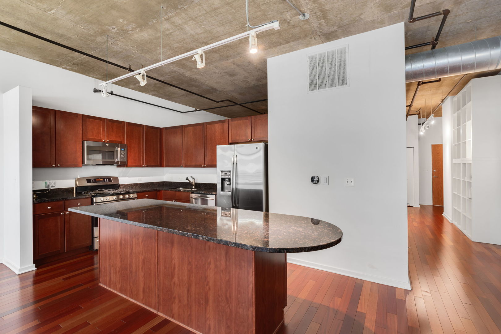 520 South State Street, Unit 705 Chicago, IL 60605 - Photo 9 of 33 a kitchen with stainless steel appliances granite countertop a sink a stove and refrigerator