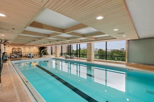 a view of a swimming pool with a porch