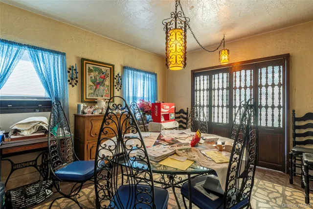 a view of a dining room with furniture window and outside view